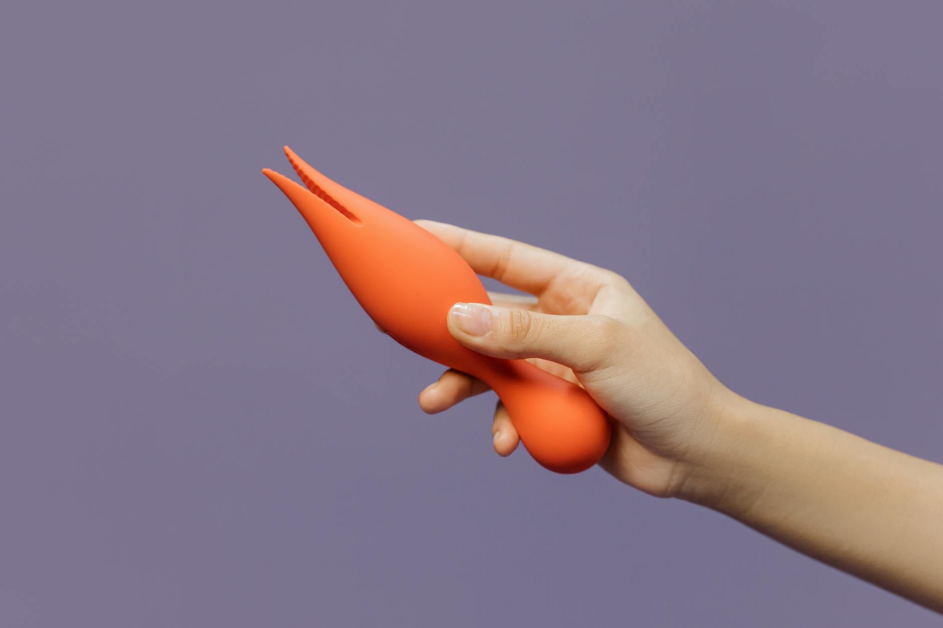 A hand holding a lemon against a vivid yellow background, conveying fresh citrusy energy